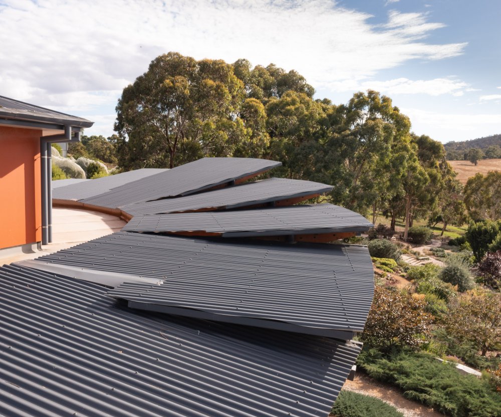 UKARIA Cultural Centre clad in LYSAGHT CUSTOM ORB® and CUSTOM ORB ACCENT® 21 shaped from COLORBOND® steel Ironstone®
