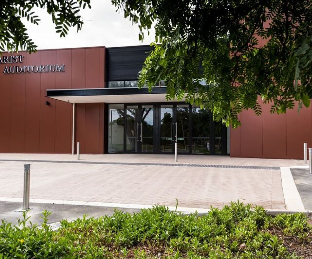 The COLORBOND® Metallic steel colour Aries® – a rich, deep red with a touch of theatrical brilliance – plays a starring role in Newman College's Marist Auditorium.